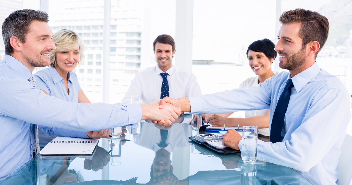 Group of business people shaking hands